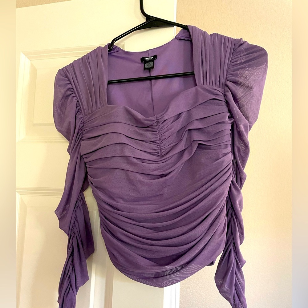 Cute Express Top with sheer arms.